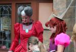 Cinderella's Step Sisters Anastasia and Drizella with their mother Lady Tremaine Character Greet outside Cinderella's Castle in Fantasyland at Disney Magic Kingdom